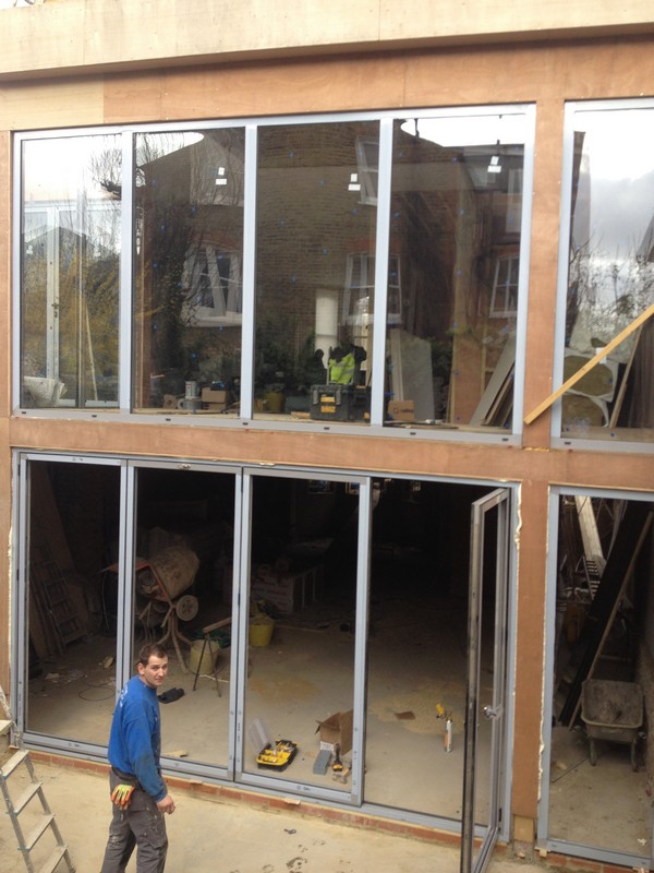 Aluminium bi-fold doors with two-storey glazing in Roehampton