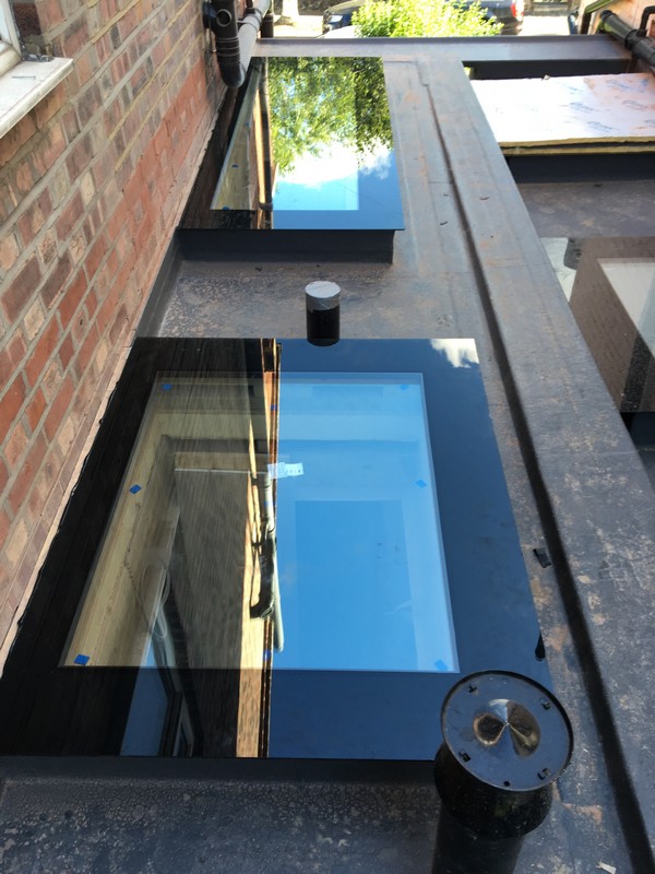 Multiple flat roof skylights on extension in Roehampton